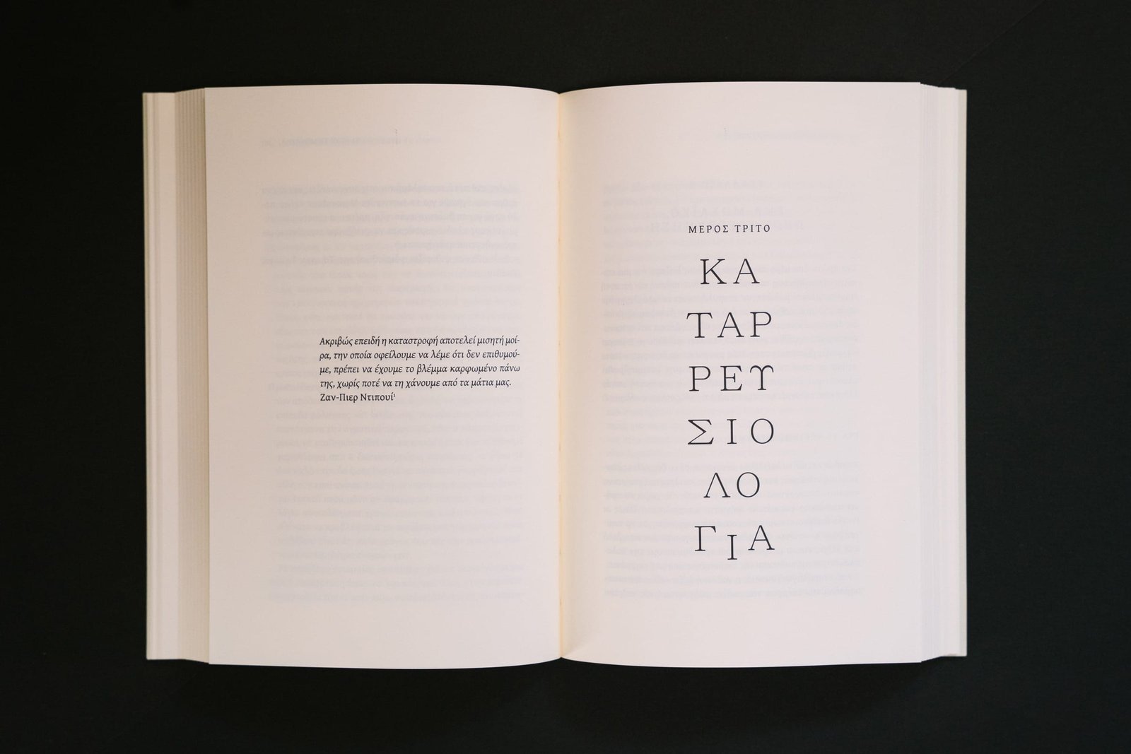 A book spread on black background, title of the third Part, Collapsology